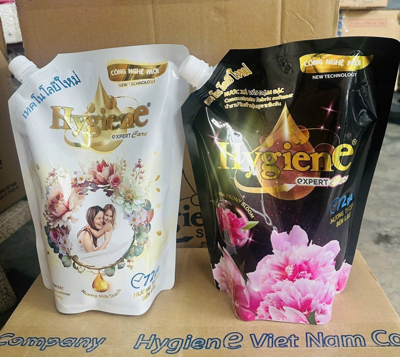 Two pouches of Hygiene Expert Care fabric softener in white and black.